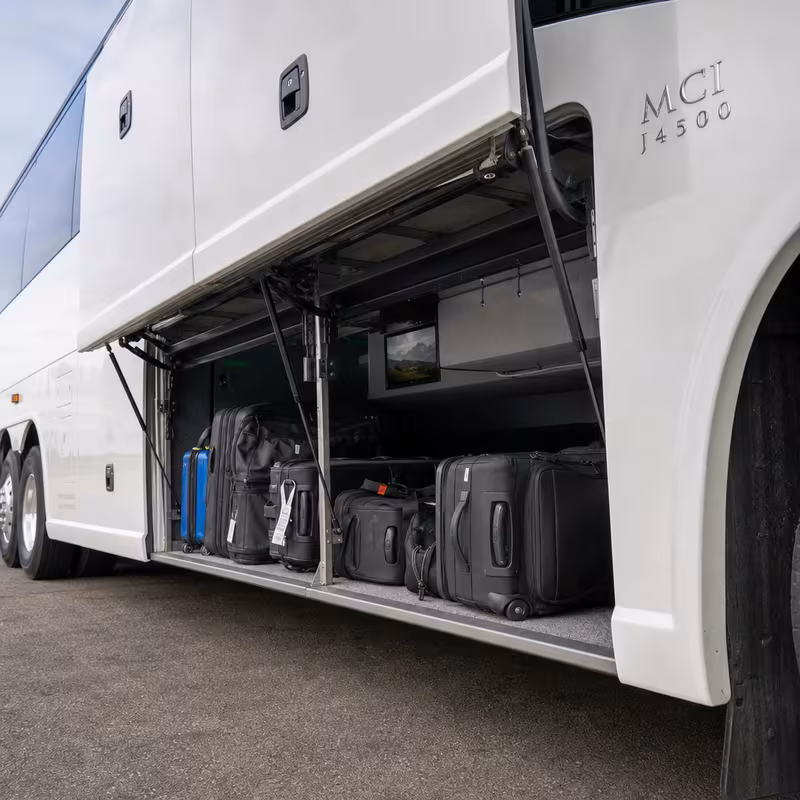 Party bus interior with wraparound leather seating and LED lighting in Peoria