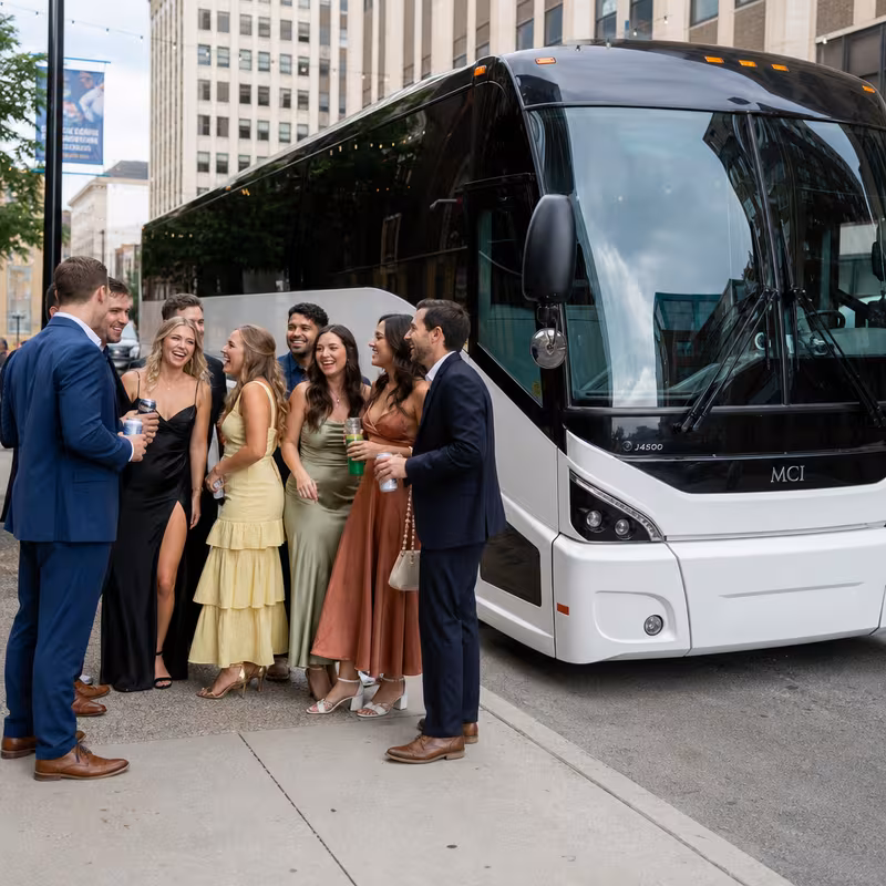 Passengers loading luggage while boarding an Peoria group shuttle