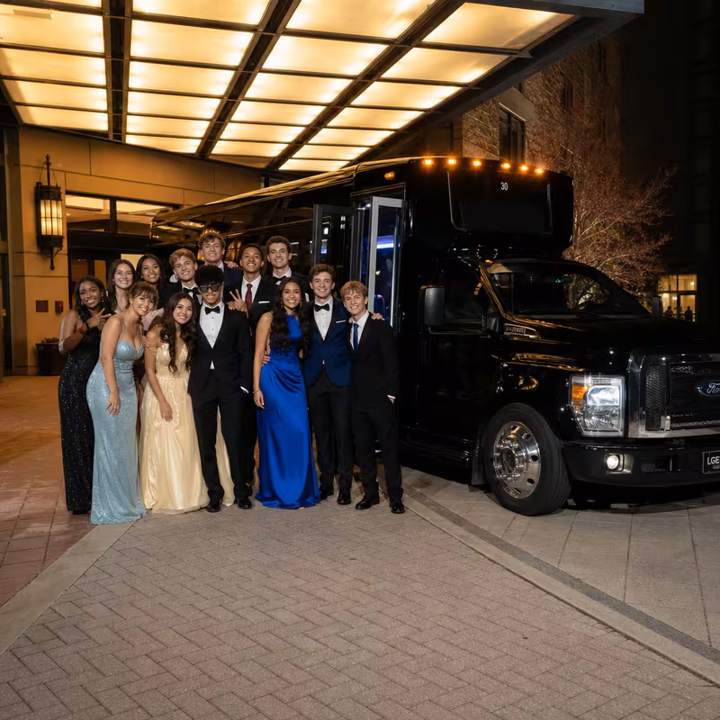 Party bus interior with wraparound leather seating and LED lighting in Peoria