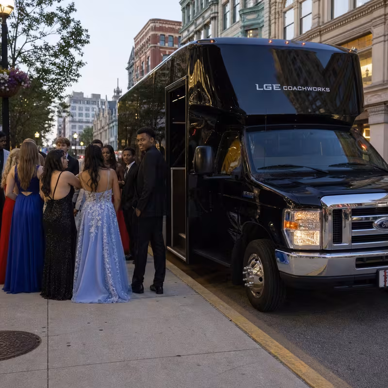 Passengers loading luggage while boarding an Peoria group shuttle