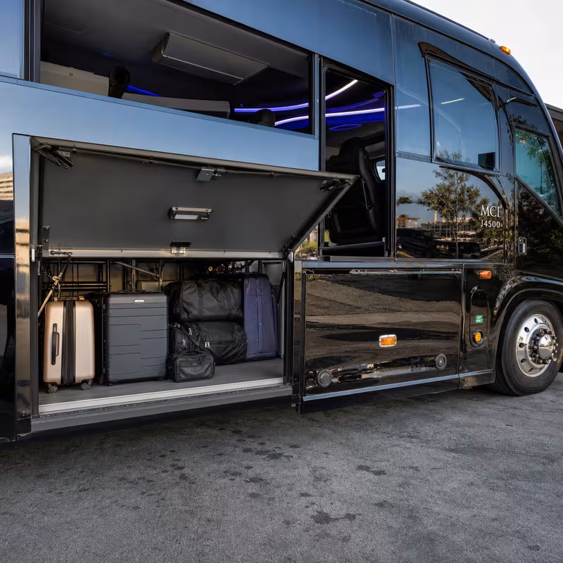 Party bus interior with wraparound leather seating and LED lighting in Peoria