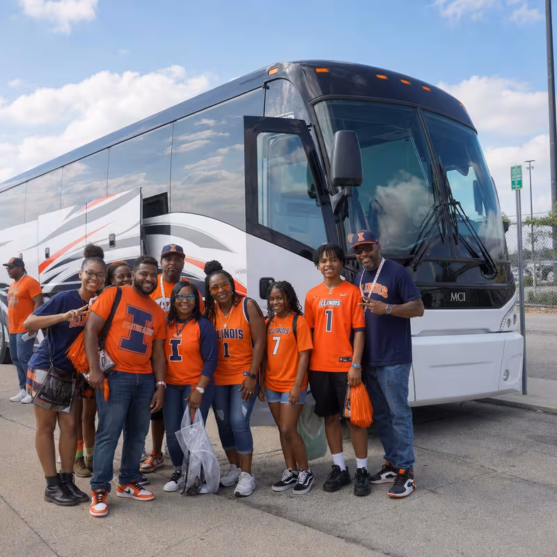 Passengers loading luggage while boarding an Peoria group shuttle