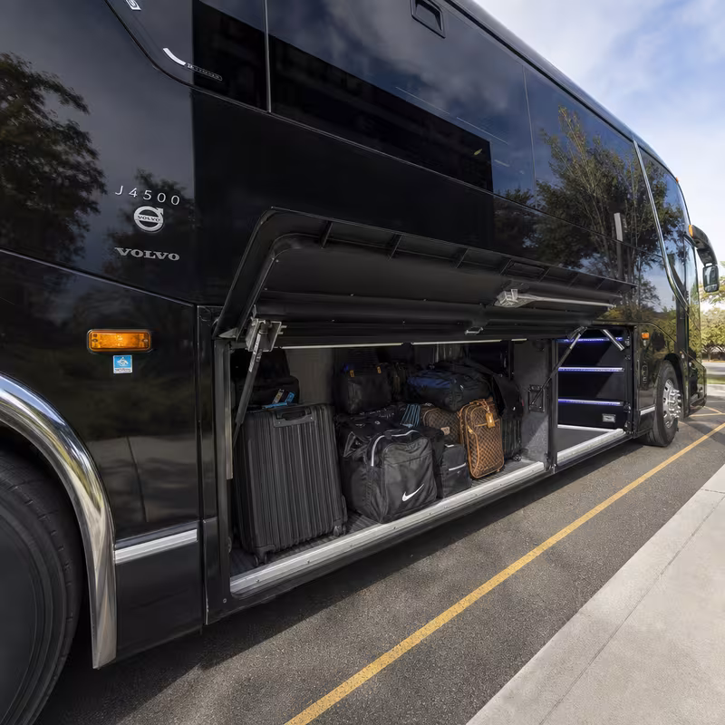 Party bus interior with wraparound leather seating and LED lighting in Peoria
